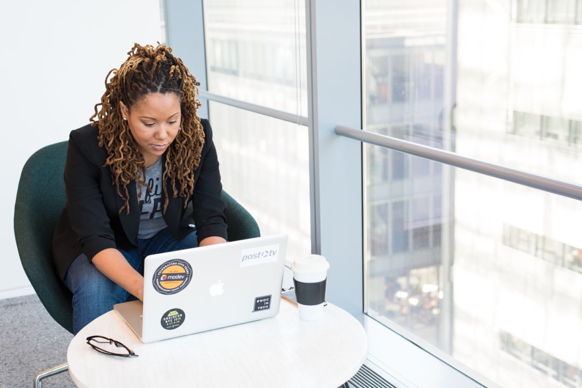 past due invoice woman at desk