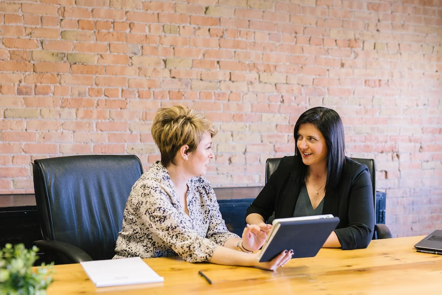 two women communicating with one another